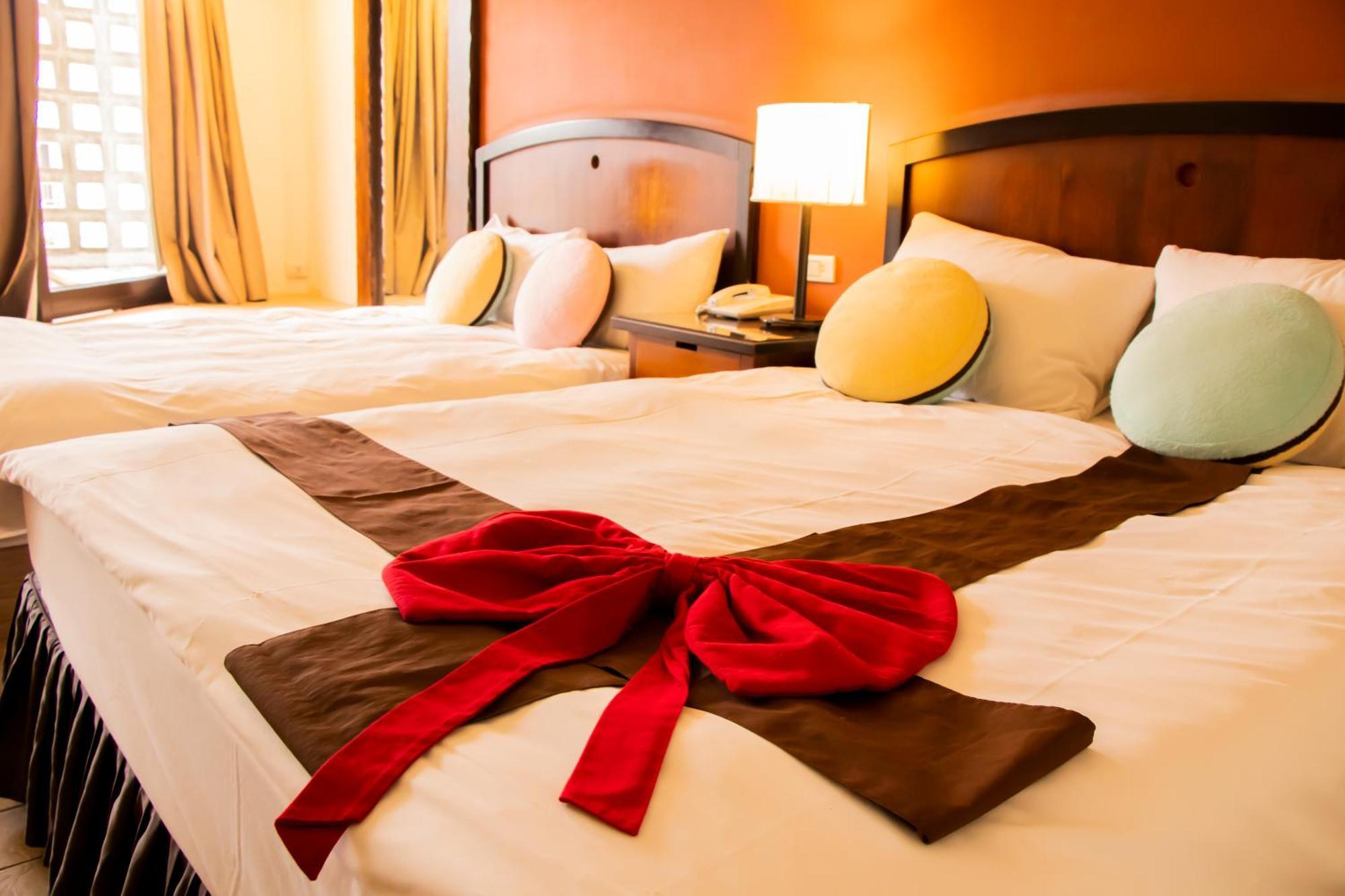 Yoho Beach Resort Kenting Heng-ch'un Exterior foto A bed with a bow